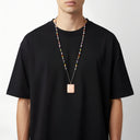 שרשרת ספר פסטל – חרוזים בגוונים רכים וקמע פתק