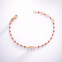 Bracelet fin en argent plaqué or rose Eliorness avec petites perles rouges et pendentif symbole Haï serti de zirconium brillants – Style fin et moderne.