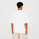 Vue arrière du t-shirt Tsitsit blanc oversize uni Eliorness montrant le tombé d'épaules bas et la coupe moderne sans motif.