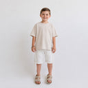 T-shirt Tsitsit enfant beige coupe oversize style streetwear confortable collection enfant Eliorness.