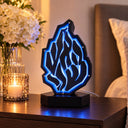 Boîte de Tsedaka lumineuse Aech Cheli noire allumée en bleu dans une chambre – Eliorness